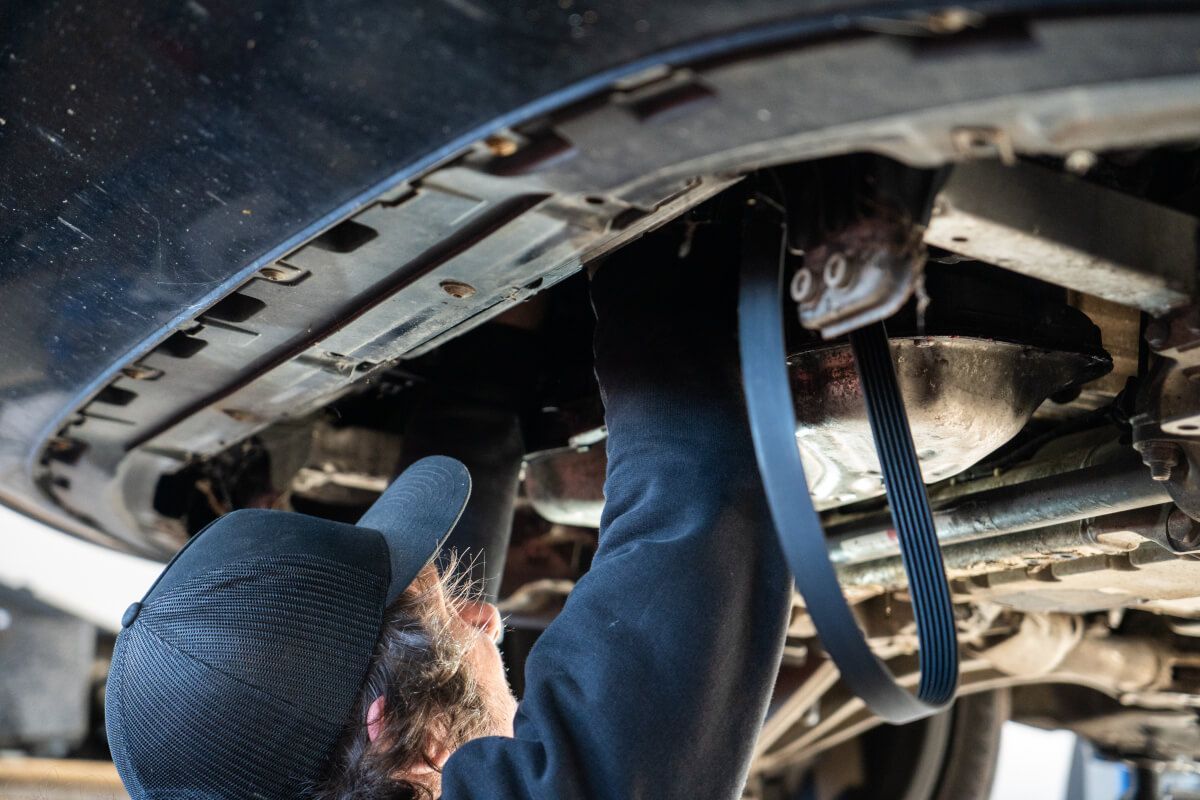 mechanic replacing a cambelt