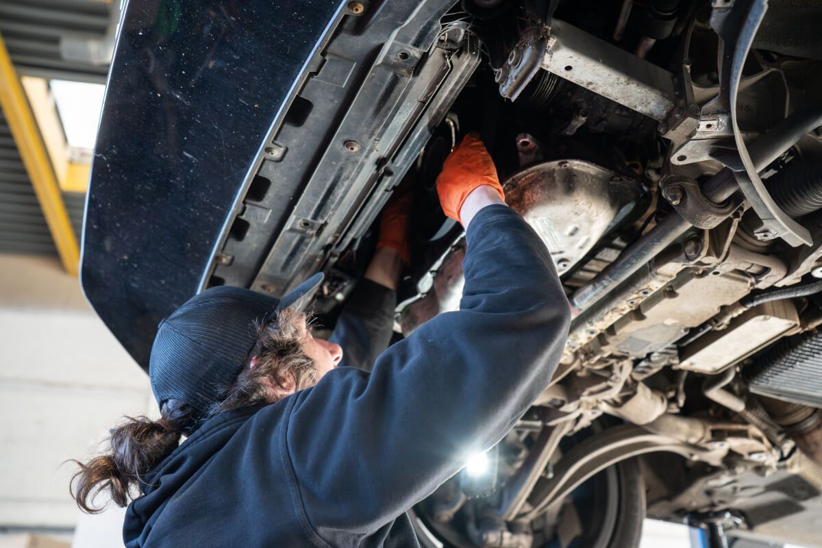 mechanic working under car