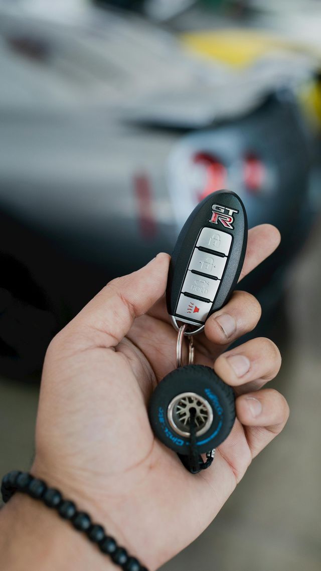 car key fob in hand